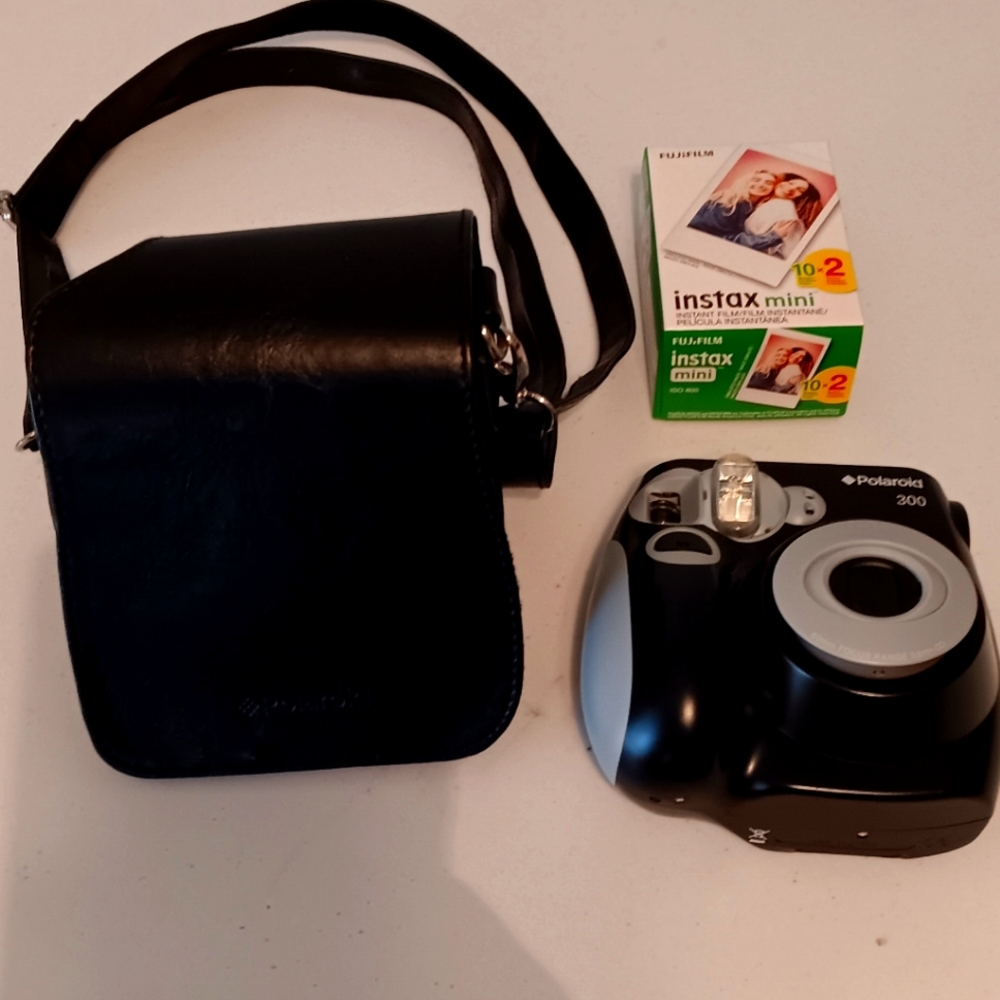 Polaroid 300 instant film camera with carrying case and film kit